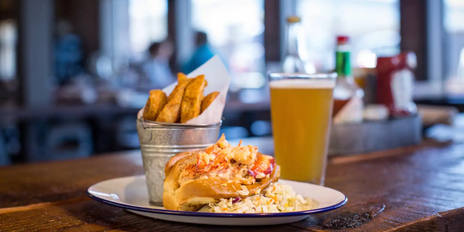 lobster roll with a pint of beer